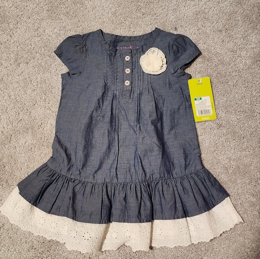 Dress with eyelet hem